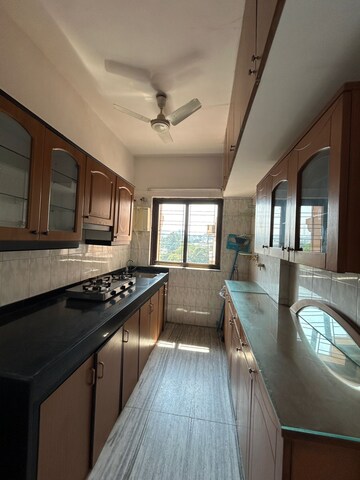 Kitchen in 2 BHK Apartment at Raheja Gardens, Netaji Nagar – for Sale