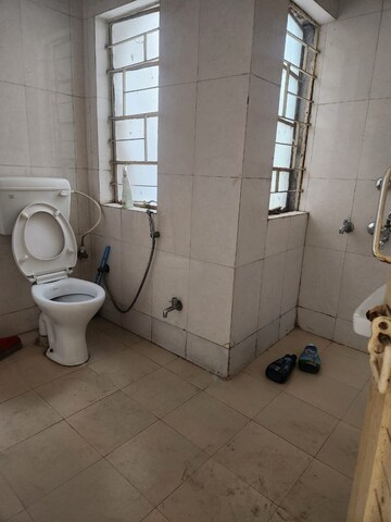 Bathroom in 2 BHK Apartment at RWA Qutab Enclave, Katwaria Sarai – for Rent