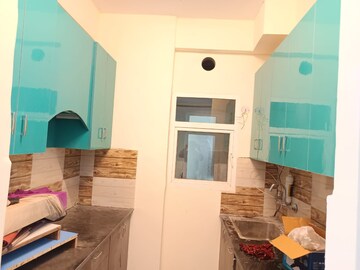 Kitchen in 2 BHK Apartment at Amrapali Dream Valley, Tech Zone 4 Greater Noida – for Rent