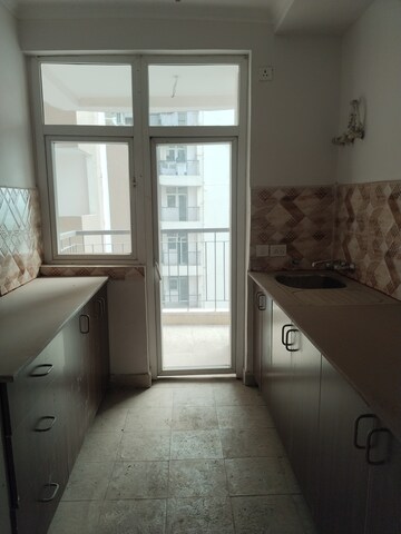 Kitchen in 3 BHK Apartment at Amrapali Leisure Park, Amrapali Leisure Valley – for Rent