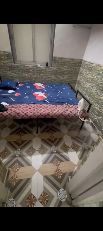 Bedroom in 1 RK Apartment at Pushpraj Building, Goregaon East – for Rent