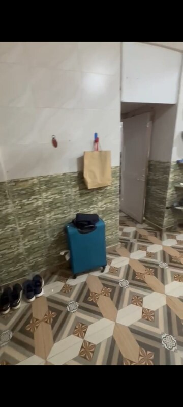 Master Bedroom in 1 RK Apartment at Pushpraj Building, Goregaon East – for Rent