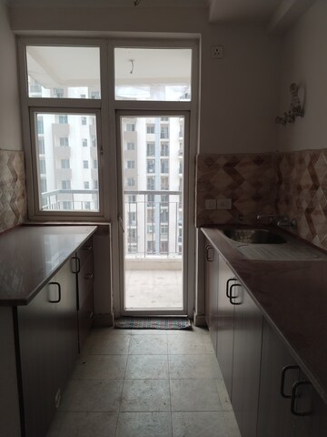 Kitchen in 2.5 BHK Apartment at Amrapali Leisure Park, Amrapali Leisure Valley – for Rent