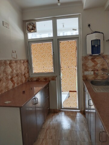 Kitchen in 2 BHK Apartment at Amrapali Leisure Park, Amrapali Leisure Valley – for Rent
