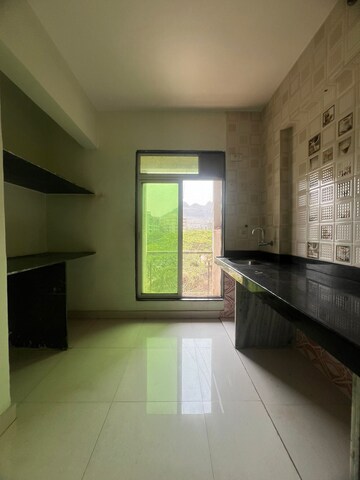 Kitchen in 1 BHK Apartment at Parsik Nagar – for Sale