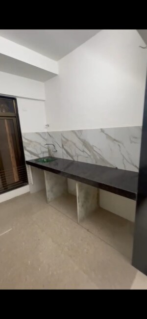 Kitchen in 1 BHK Apartment at Neelyog Towers, Malad East – for Sale