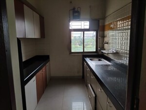 Kitchen in 2.5 BHK Apartment at Vijay Enclave, Waghbil – for Sale