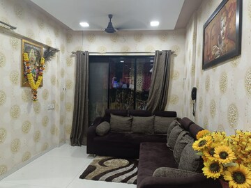 Living Room in 1 BHK Apartment at RNA NG Canary, Mira Road – for Rent