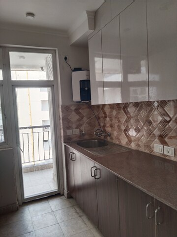 Kitchen in 3 BHK Apartment at Amrapali Leisure Park, Amrapali Leisure Valley – for Rent