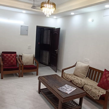Living Room in 2 BHK Apartment at Gardenia Golf City, Noida Central – for Rent