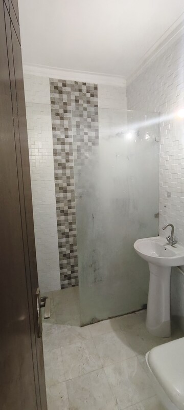 Bathroom in 3 BHK Builder Floor at Rely Home, Green Fields Colony – for Rent