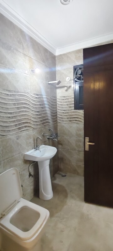 Bathroom in 3 BHK Builder Floor at Rely Home, Green Fields Colony – for Rent