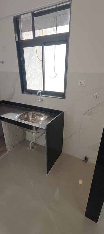 Kitchen in 2 BHK Apartment at Dev Leo Tower, Oshiwara – for Rent