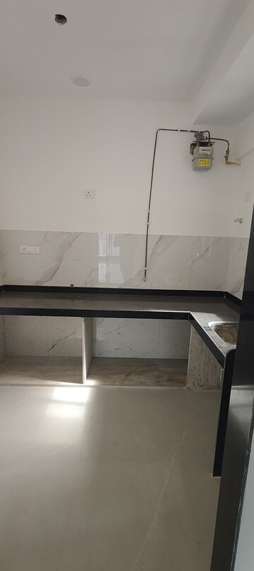 Kitchen in 2 BHK Apartment at Dev Leo Tower, Oshiwara – for Rent