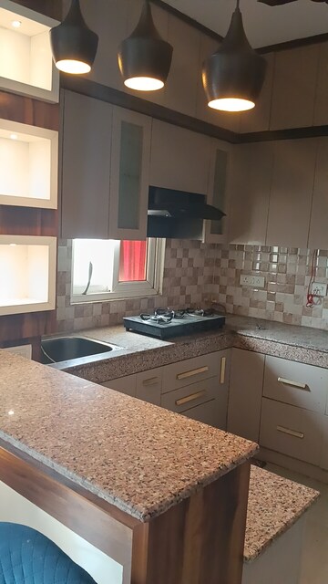 Kitchen in 2 BHK Apartment at AFOWO Raksha Addela, Sector 16c Greater Noida – for Rent