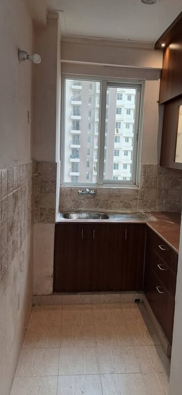 Kitchen in 2 BHK Apartment at Amrapali Golf Homes, Sector 4 Greater Noida – for Sale