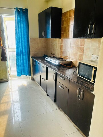 Kitchen in 2.5 BHK Apartment at Aims Golf City, Sector 75 – for Rent