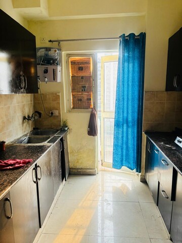 Kitchen in 2.5 BHK Apartment at Aims Golf City, Sector 75 – for Rent