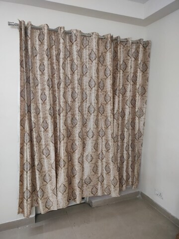 Bedroom in 2 BHK Apartment at Sikka Karnam Greens, Sector 143b – for Rent
