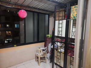 Living Room in 2 BHK Apartment at Gangadham Apartment, Market Yard – for Sale