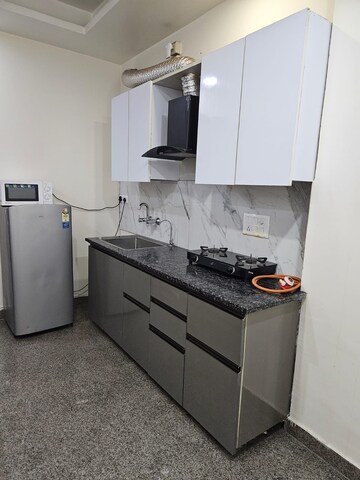 Kitchen in 2 BHK Builder Floor at Ansal Sushant Lok I, Sector 43 – for Rent