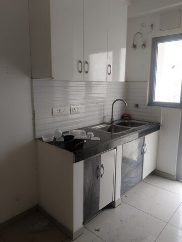 Kitchen in 2 BHK Apartment at Gulshan Bellina, Sector 16 Greater Noida – for Rent