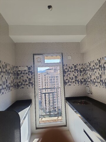 Kitchen in 1 BHK Apartment at Raunak Bliss, Ghodbunder Road – for Rent