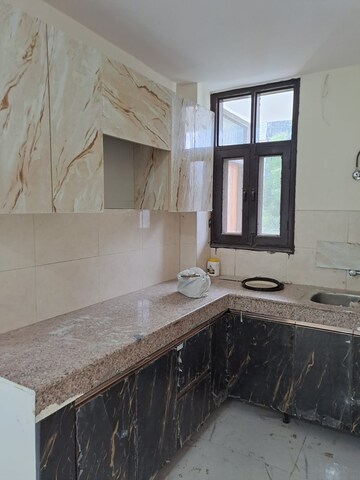 Kitchen in 1 BHK Apartment at DMD Hometech Awas Yojna, Sector 73 – for Sale