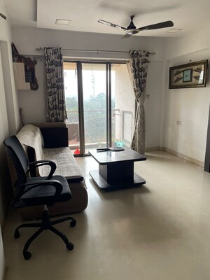 Living Room in 2 BHK Apartment at Unnati Woods CHS, Kasarvadavali – for Sale