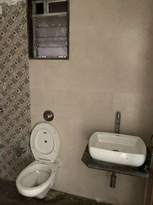 Bathroom in 1 BHK Apartment at Unnati Woods CHS, Kasarvadavali – for Sale