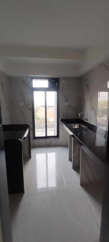 Kitchen in 1 BHK Builder Floor at Tharwani Vedant Millenia, Titwala – for Sale