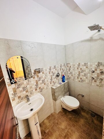Bathroom in 2 BHK Apartment at Guru Nanak Enclave, Dhakoli – for Rent