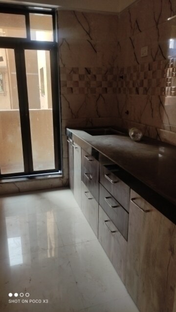 Kitchen in 1 BHK Apartment at Raunak Bliss B2, Ghodbunder Road – for Rent