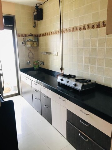 Kitchen in 1 BHK Apartment at Raunak Bliss B2, Ghodbunder Road – for Rent