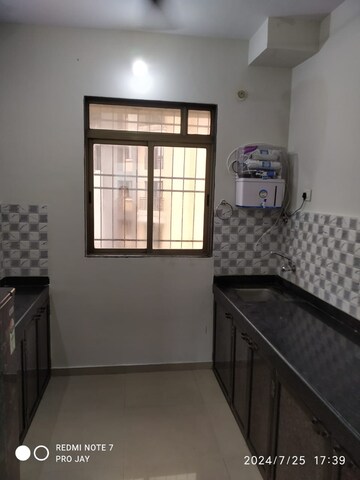 Kitchen in 1 BHK Apartment at Srushti Siddhi Mangal murti Complex, Bhadwad Gaon – for Sale