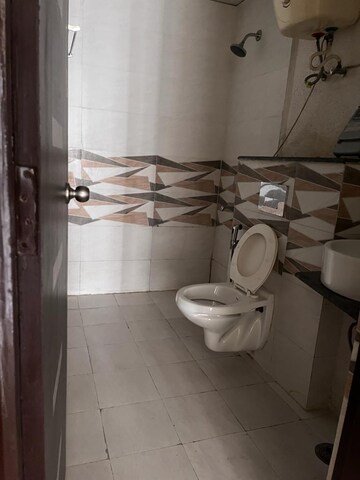 Bathroom in 3 BHK Apartment at Gaur Sportswood, Sector 79 – for Rent
