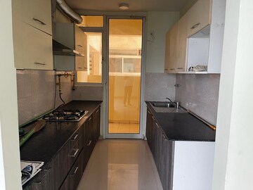 Kitchen in 3 BHK Apartment at Mahagun Mirabella, Sector 79 – for Rent