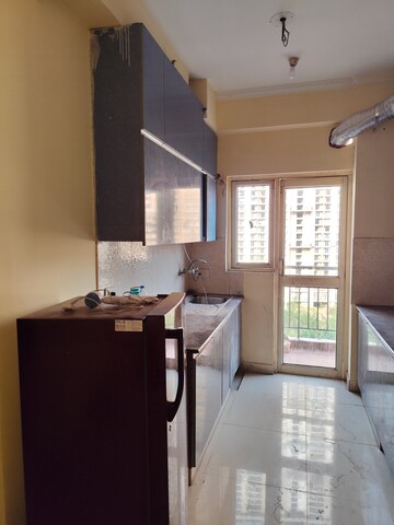 Kitchen in 2 BHK Apartment at Aims Golf City, Sector 75 – for Rent