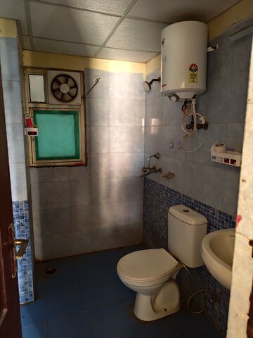 Bathroom in 2 BHK Apartment at Aims Golf City, Sector 75 – for Rent