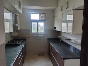 Kitchen in 4 BHK Apartment at Puri Anand Villas Phase II, Sector 81 – for Sale