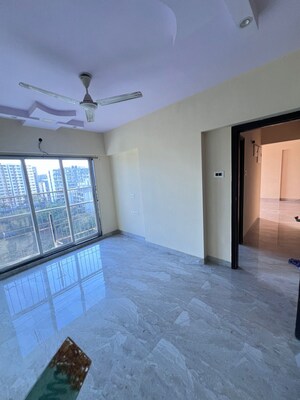 Room in 2.5 BHK Apartment at SD Alpine Tower, Kandivali East – for Sale