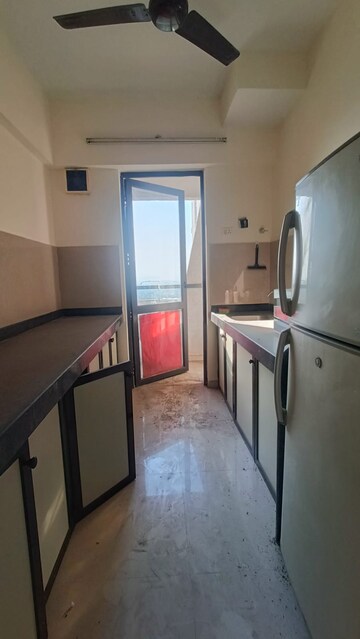 Kitchen in 1 BHK Apartment at Lodha Lakeshore Greens, Dombivli East – for Rent
