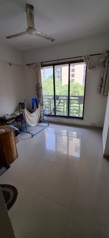 Living Room in 1 BHK Apartment at Raunak Bliss, Ghodbunder Road – for Rent