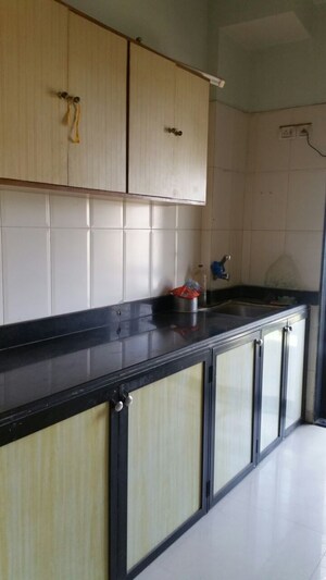 Kitchen in 3 BHK Apartment at Sandstone CHS Ltd, Mira Road – for Sale