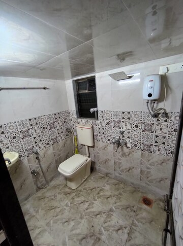 Bathroom in 2 BHK Apartment at Poonam Sagar Complex, Mira Road – for Sale