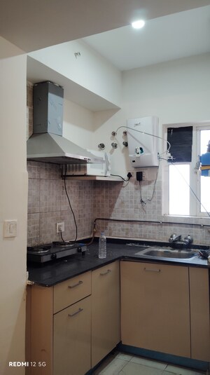 Kitchen in 1 BHK Apartment at Paras Tierea, Sector 137 – for Sale