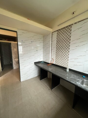Kitchen in 1 BHK Apartment at Mohan Willows, Badlapur East – for Sale