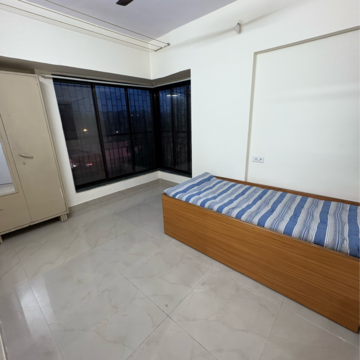 Bedroom in 1 BHK Apartment at Rupji Vrindavan, Tilak Nagar – for Rent