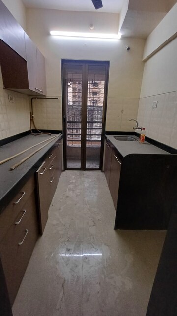 Kitchen in 2 BHK Apartment at Courtyard by Narang Realty and The Wadhwa Group, Pokhran Road No Two – for Rent