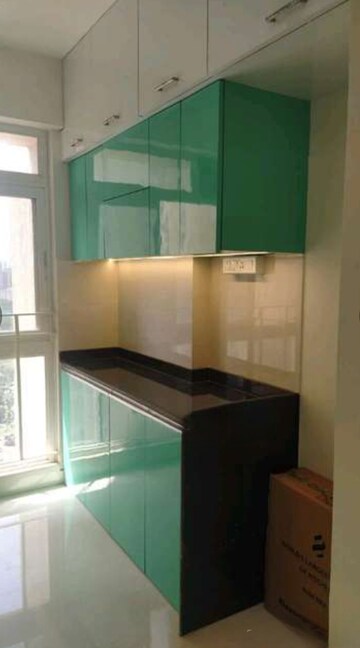 Kitchen in 2 BHK Apartment at Rustomjee Urbania Azziano, Majiwada – for Sale